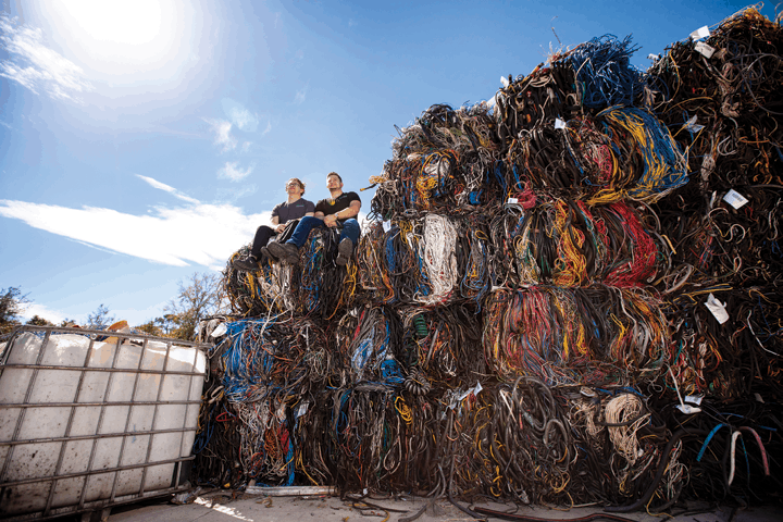 GLE Scrap Metal co-founders Nathan and Danny Zack at the company’s wire chopping facility in Ocoee, Florida (Photo by Jack Goras Photography)
