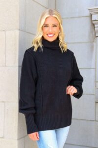 A Woman Wearing Black Turtle Neck Sweater