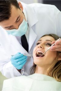 Dentist in Salt Lake city examining a Patient