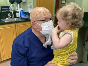 Abilene dentist Dr. Sam Spence interacting with a kid